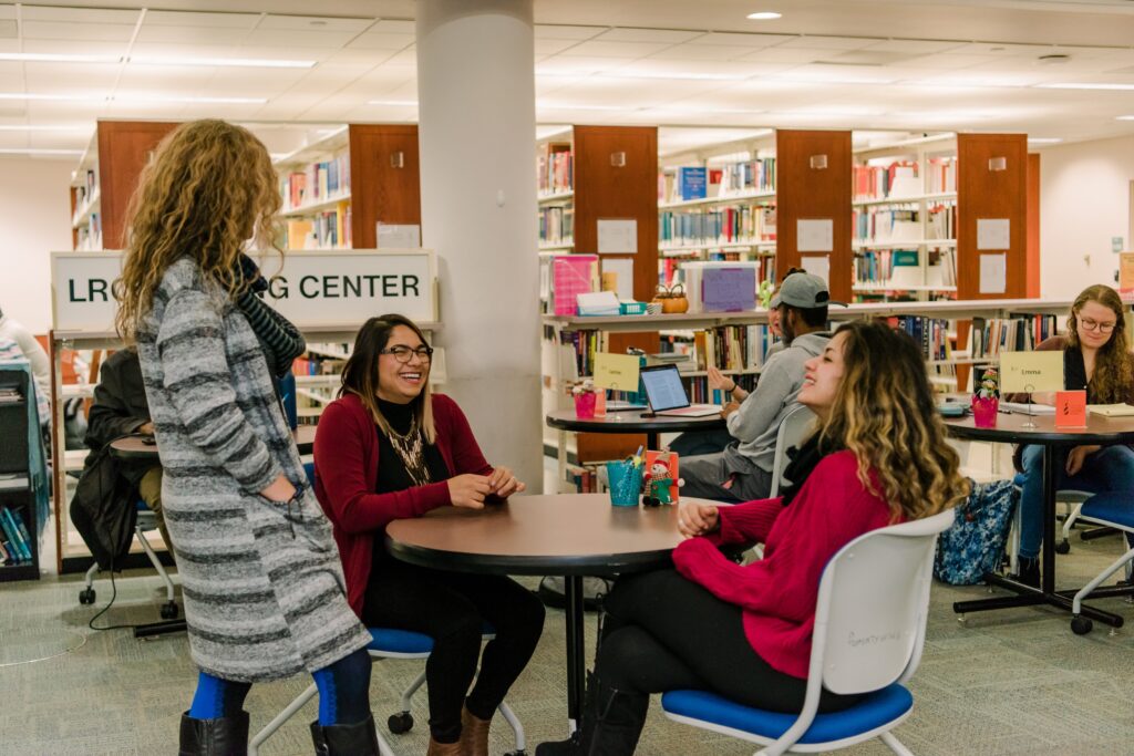 Staff with students at writing center