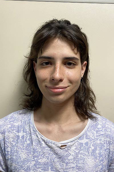 A student smiling at school