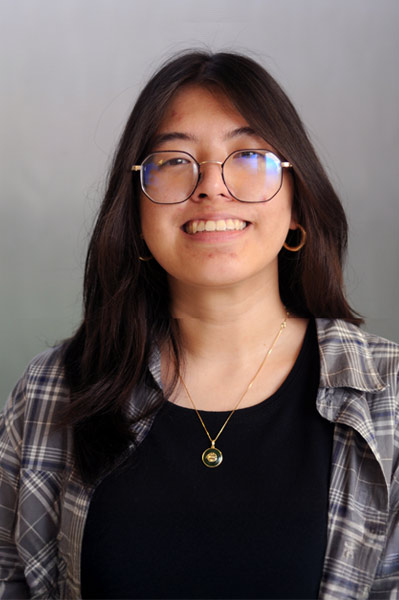 An informal portrat of a young smilling undergraduate